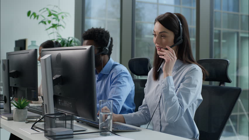 Call center support multiethnic business men women workers agents headphones headset telemarketing virtual assistant operators working computer typing customer client helpline distance office online - Powered by Shutterstock - Get 15% off with code: PIKWIZARD15