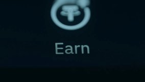 Finger taps Earn button on trading app, macro view - Powered by Shutterstock - Get 15% off with code: PIKWIZARD15