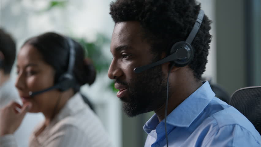 Business people multiethnic call center operators worker African American man headset scream shouting yes celebrating triumph help line consultation salesman selling victory sale success at callcenter