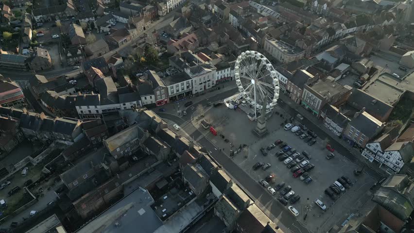 Explore the charming streets of Ripon featuring a delightful Ferris wheel and picturesque townscape