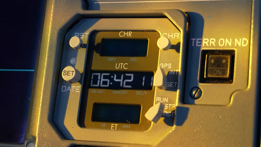 Cockpit Digital Clock Display in Early Morning Sunlight