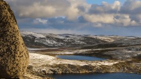 Drone footage captures a frozen moorland lake surrounded by tundra and snowy plains at Titovy Ridge in Arctic Russia. - Powered by Shutterstock - Get 15% off with code: PIKWIZARD15