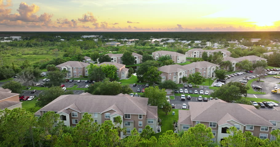 Suburban Florida residential complex with modern condominiums and landscaped surroundings, illustrating U.S. housing trends.