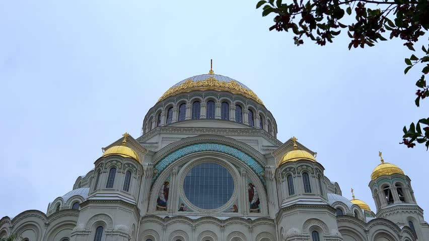 KRONSTADT, Russia - September 14, 2024: St. Nicholas Naval Cathedral. The Kronstadt Naval Cathedral on Yakornaya Square in cloudy weather in autumn. Autumn Kronstadt. Kotlin Island. 4K