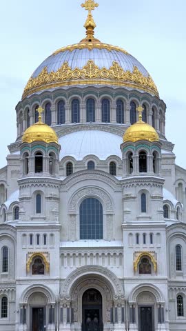 KRONSTADT, Russia - September 14, 2024: St. Nicholas Naval Cathedral. The Kronstadt Naval Cathedral on Yakornaya Square in cloudy weather in autumn. Autumn Kronstadt. Kotlin Island. 4K
