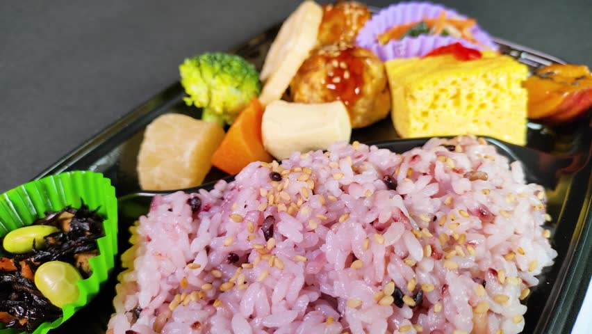 Multigrain rice bento close up, rotating