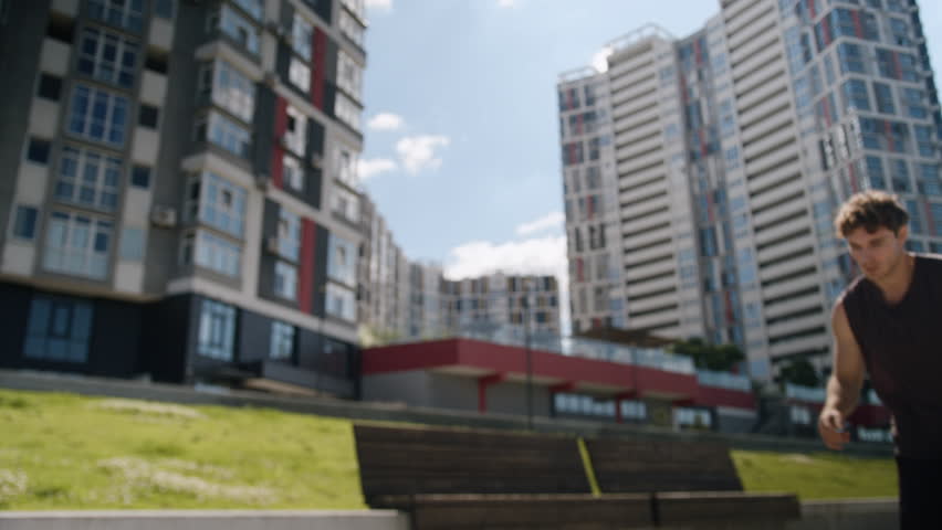 Exhausted Caucasian European young man tired guy male athlete outdoors sportsman break jog running sport training workout hard breath sweaty stop relax sportive activity lifestyle runner city street