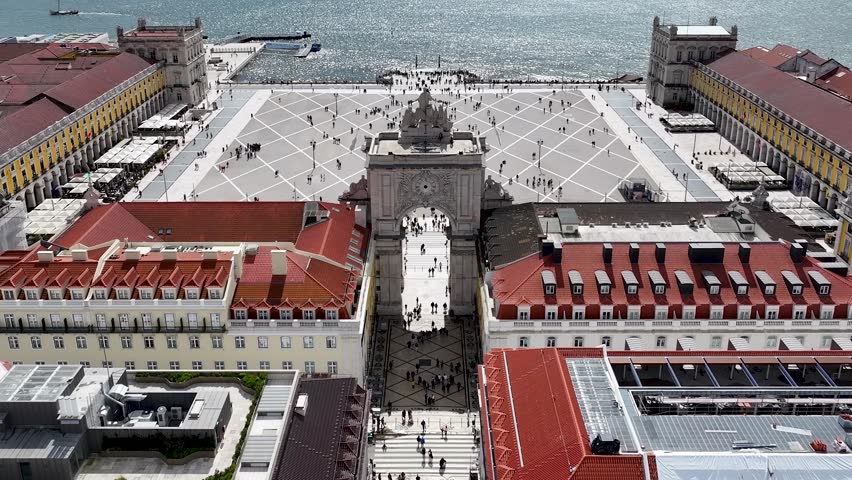 Comercio Square At Lisbon Lisbon District Portugal. Aerial View Of A City Park Surrounded By Busy Streets And Buildings. Town Sky Clouds Backgrounds Urban. Outside Backgrounds Panning Wide.