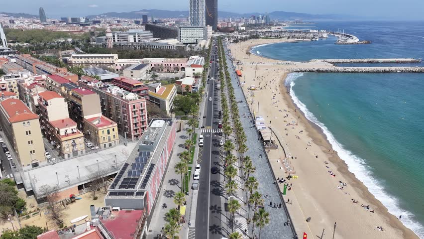 Barceloneta Beach At Barcelona Barcelona Province Spain. Birds Eye View Of Stunning Cityscape With Streets And Buildings. Shore Sky Clouds Beach Sea. Seaside Travel. Barcelona Barcelona Province.