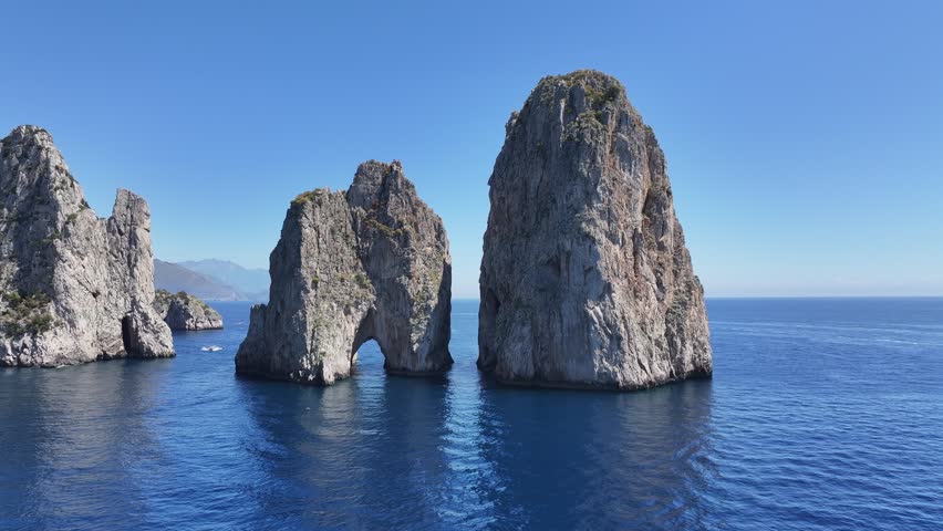 Faraglioni Of Capri At Naples Campania Italy. Turquoise Ocean Waves Gently Crashing On Tropical Beach. Holiday Skyline Recreation Stunning. Holiday Waterfront Shore. Naples Campania.
