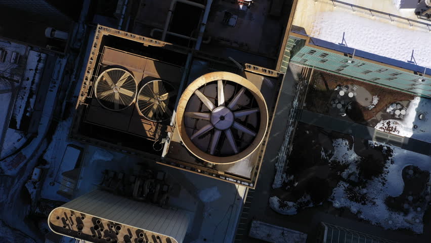 Large rooftop fans aerial rotating reveal 4k