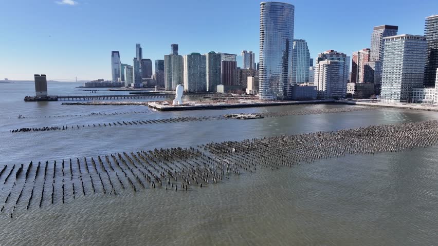 Hudson River Walkway At Jersey City New Jersey United States. Aerial View Of A High-Rise Buildings And Traffic Showcasing Urban Life. Town Sky Clouds Backgrounds Urban. Backgrounds Downtown Panoramic.