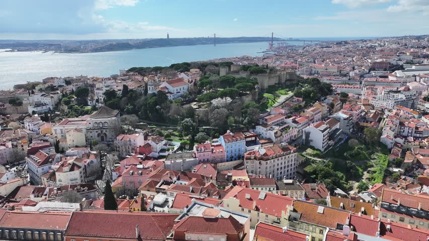 Sao Jorge Castle At Lisbon Lisbon District Portugal. Aerial View Of A High-Rise Buildings And Traffic Showcasing Urban Life. Town Sky Backgrounds Urban. Town Panorama. Lisbon Lisbon District.