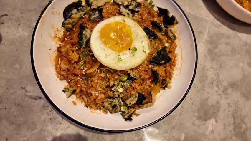 Fried rice with Samyang paste. Spicy food. Korean famous food with sunny egg