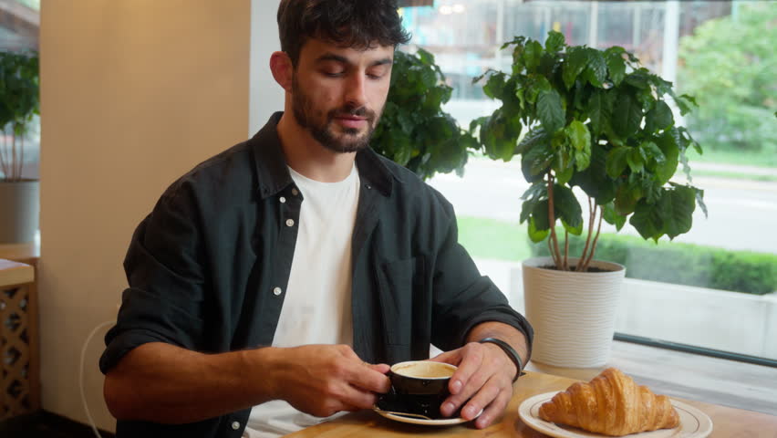Caucasian man drinking coffee croissant male guy showing gesture ok cafe restaurant client visitor order lunch okay good approval recommend business businessman tasting breakfast indoor hand customer