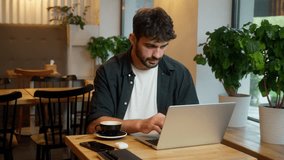 Caucasian man waving hand online meeting video call freelancer entrepreneur male talking conversation laptop guy businessman business virtual consulting job indoors office cafe chatting work interview - Powered by Shutterstock - Get 15% off with code: PIKWIZARD15