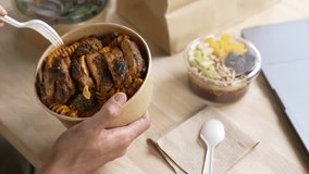 Man eating healthy meal while working, Businessman having a lunch break at the office - Powered by Shutterstock - Get 15% off with code: PIKWIZARD15