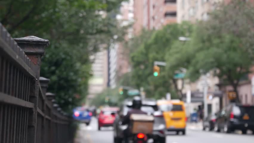 New York City Park Avenue. Grand Central Terminal railway station on 42 street. Manhattan Midtown. Yellow taxi cab in NYC, USA. American urban road car traffic, transport in United States. Defocused.