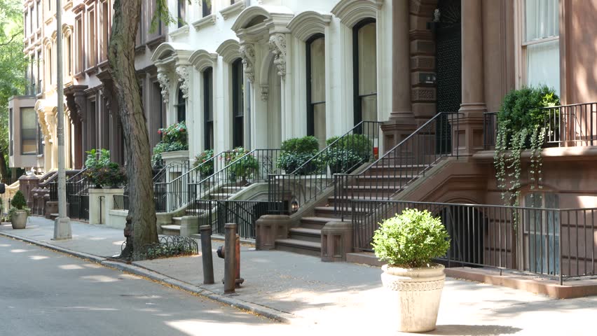 New York City townhouse building, Brooklyn Heights residential district, USA. Brownstone urban architecture, attached house. United States real estate, american property, apartments and homes in NYC.