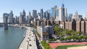 Brooklyn Bridge from Manhattan Bridge. New York City downtown skyline, financial district cityscape, World Trade Center. Transport traffic on FDR Drive highway by East River water, United States. - Powered by Shutterstock - Get 15% off with code: PIKWIZARD15
