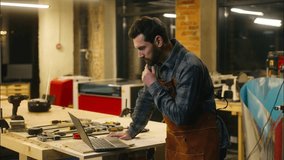 Cheerful Caucasian man wood master carpenter using laptop in workshop builder searching information in Internet guy male chatting social media network pc repairman smile workman order materials online - Powered by Shutterstock - Get 15% off with code: PIKWIZARD15