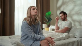 Family argument stressed Caucasian couple in bedroom divorce frustrated husband ignore sad worried woman wife relationship psychological problem breakup pair quarrel arguing morning man avoid speaking - Powered by Shutterstock - Get 15% off with code: PIKWIZARD15