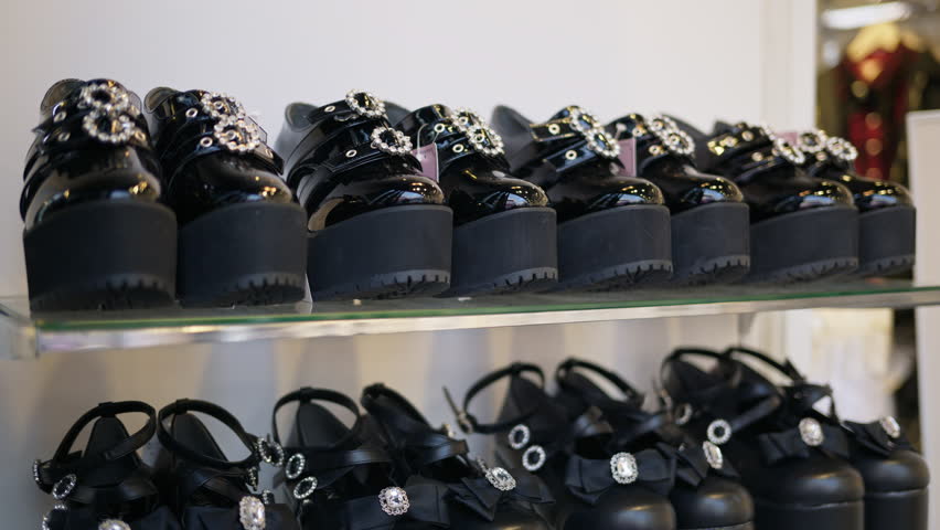 Multiple platform shoes on display in a store on the Takeshita shopping street in Tokyo, Japan