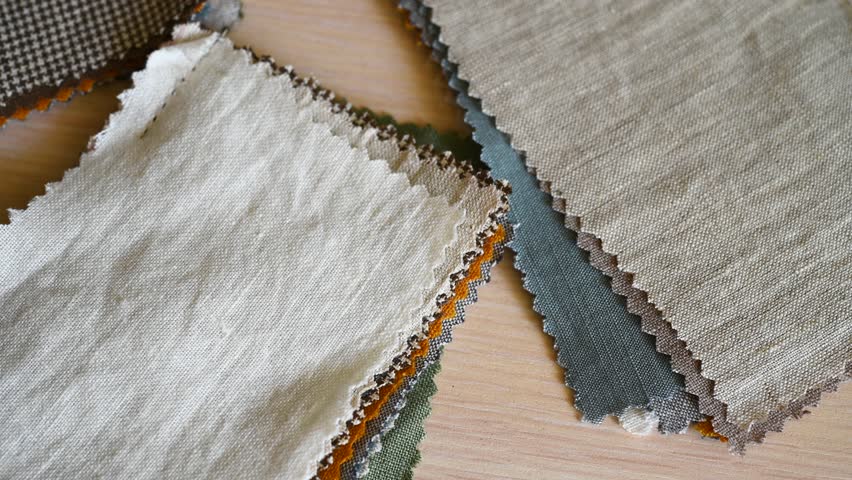 Fabric samples for sewing bed linen and home textiles. Palette with multi-colored linen scraps, stock video
