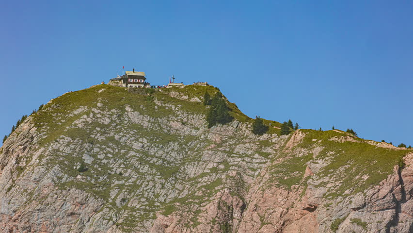 Time lapse, people on the mountain peak. Grosser Mythen mountain in canton of Schwyz, Switzerland.