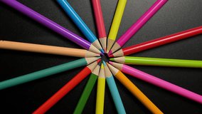 Vivid Colored Pencils Arranged in a Radial Pattern on Black Surface Highlighting Creative Art Supplies - Powered by Shutterstock - Get 15% off with code: PIKWIZARD15