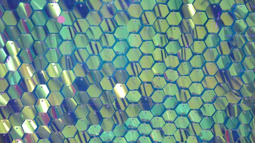 Shiny blue sequins in close-up. A photo zone made of sequins
