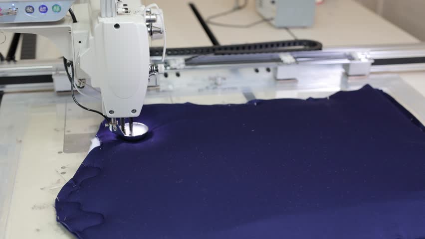 The process of sewing a riding saddle or a padded chair seat on a sewing machine