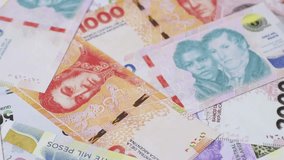 Background of Argentine peso paper money, notes with different denominations. Doing business, conceptual background - Powered by Shutterstock - Get 15% off with code: PIKWIZARD15