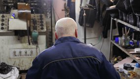 Hands of shoemaker dealing with cobbler tool. Shoemaker makes shoes - Powered by Shutterstock - Get 15% off with code: PIKWIZARD15
