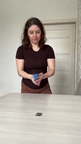 Caucasian woman wiping dining table with cloth. 