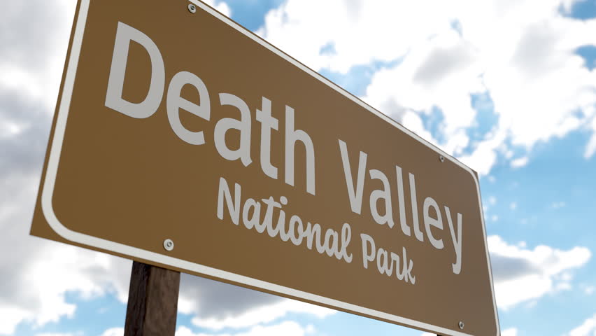 Death Valley National Park (California, Nevada) Road Sign Against Blue Sky and Clouds. One of The US National Parks Series.
