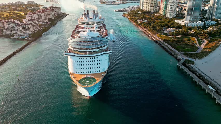 Departing ship. Miami tour. Cruise ship voyage. Aerial view of cruise in summer vacation. Cruise ship tour and travel at sea. Aerial view of luxury liner voyage. Ship leaving Miami beach port