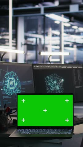 Vertical video Isolated screen laptop and computer in data center overseeing server infrastructure powering artificial intelligence workflows. Mockup notebook used for monitoring equipment