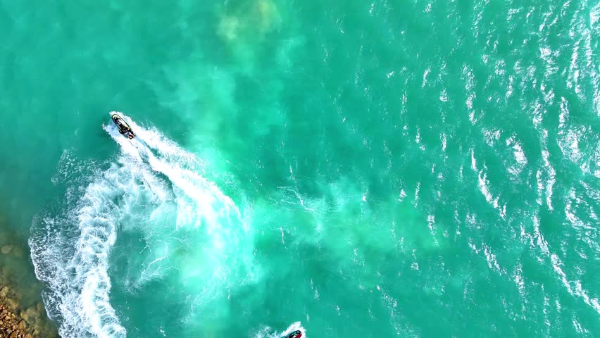 Water activities in a jet ski in Red Sea - Saudi sport - Drone Aerial view 4k video