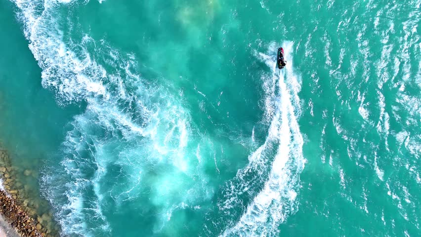Water activities in a jet ski in Red Sea - Saudi sport - Drone Aerial view 4k video