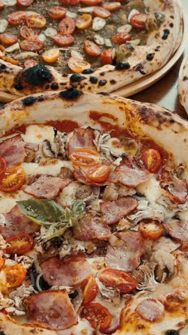 vertical clip. Italian pizza on the table. Neapolitan style pizza