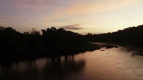 Low flight over river reflecting pre-dawn golden sky, peaceful nature - Powered by Shutterstock - Get 15% off with code: PIKWIZARD15