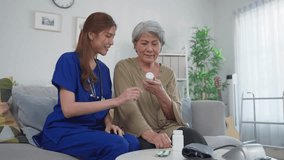 Asian caregiver give consultant to senior woman patient at nursing home. Attractive nurse carer giving medicine pills bottle, explain prescription to elderly mature grandmother in living room in house - Powered by Shutterstock - Get 15% off with code: PIKWIZARD15
