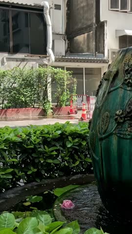 Water flowing from a decorative urban fountain.