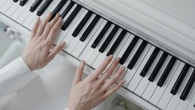 Close-up shot of hands playing a piano, showcasing musical talent and elegance in a serene setting. Perfect for themes of music, creativity, and artistry. Close-Up of Hands Playing Piano - Powered by Shutterstock - Get 15% off with code: PIKWIZARD15