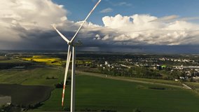 Closeup Of Wind Turbine Rotor Blades Spinning And Generating Renewable Energy In The Countryside. - aerial shot - Powered by Shutterstock - Get 15% off with code: PIKWIZARD15
