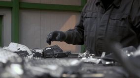 Men workers of garbage processing plant sort garbage. Male workers sort and recycle scrap metal. Plastic, polymer household waste is transported on conveyor belt in factory. Ecology of planet. Man - Powered by Shutterstock - Get 15% off with code: PIKWIZARD15