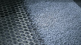 Extruder machine makes plastic granules, recycling polypropylene. Gray or white plastic pellets. Raw material for plastic or Polyethylene products. Garbage factory, waste plant. Recycling industry - Powered by Shutterstock - Get 15% off with code: PIKWIZARD15