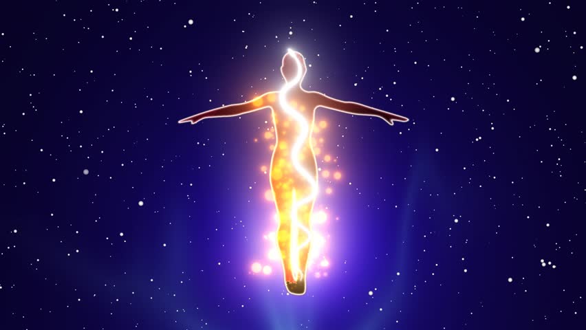 Silhouette of a person standing with his arms outstretched with the effect of kundalini energy flow