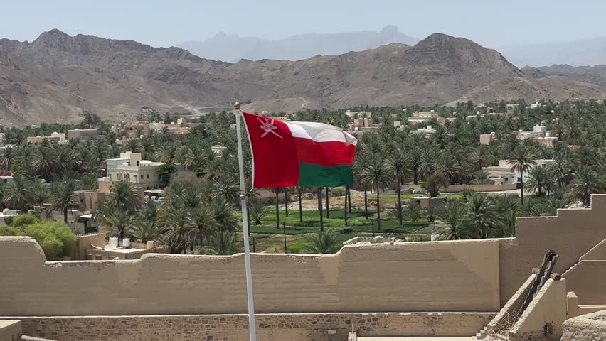 Bahla Fort in Oman with waving national flag